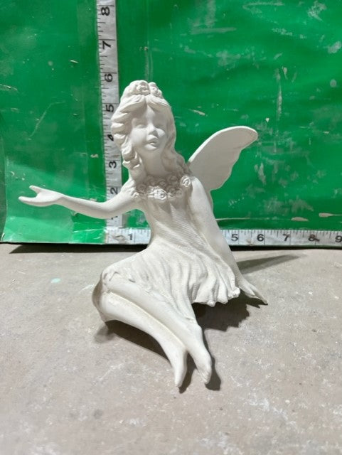 fairy sitting down
